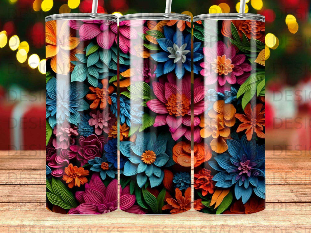 Three tumblers featuring a vibrant, colorful floral pattern.