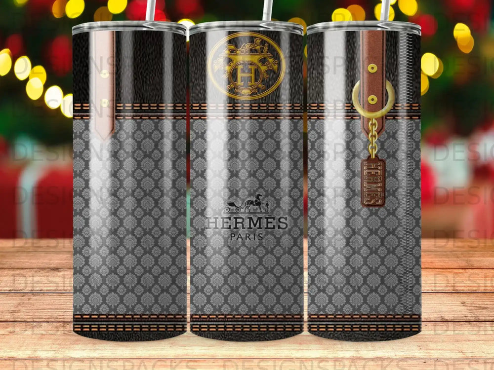 Hermes Paris logo on a patterned tumbler with leather strap detail.