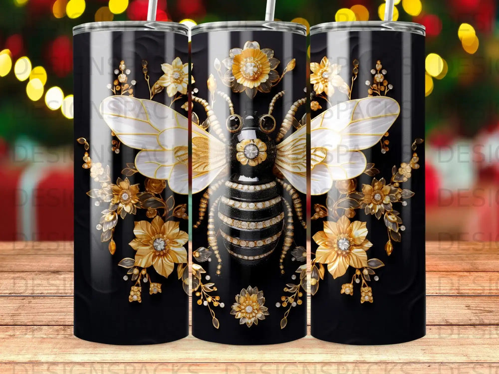 Black tumbler with a gold and white bee surrounded by floral embellishments.