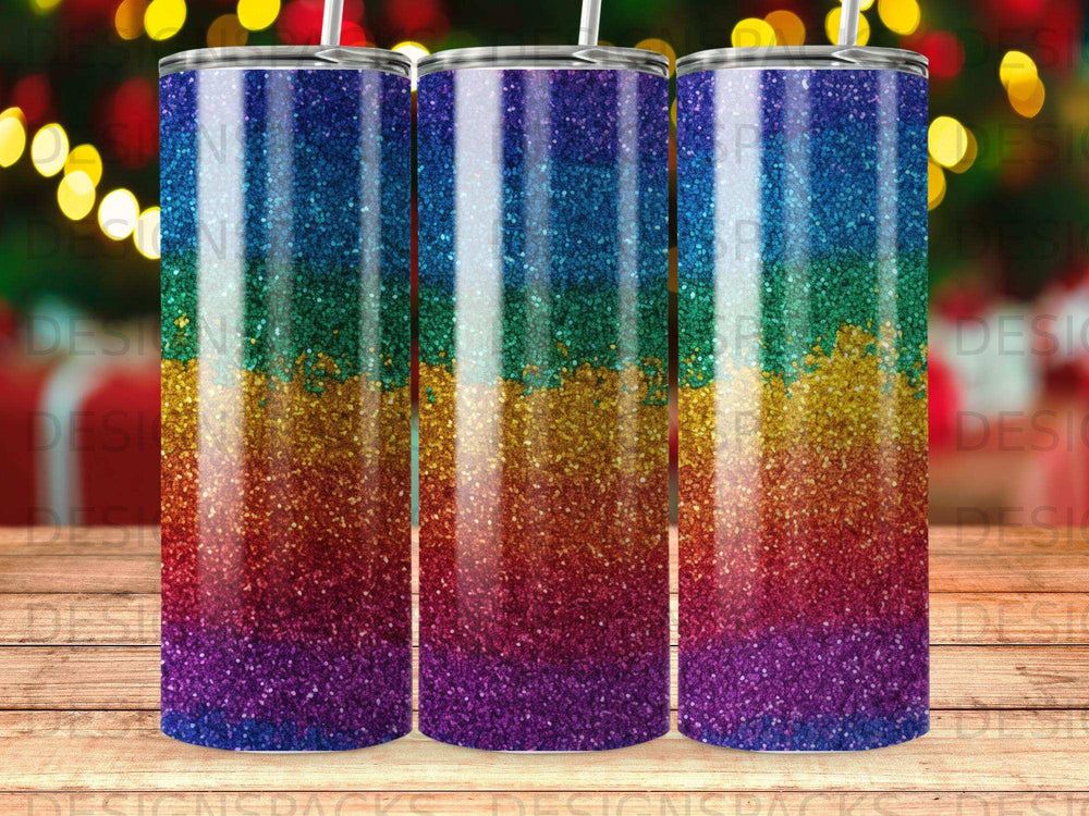 Tumbler with glitter rainbow stripes and straw.