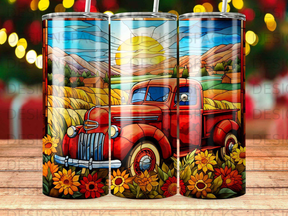 Red vintage truck in a field of sunflowers and wheat under a sunny sky.
