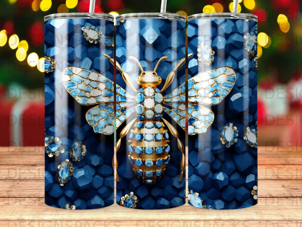 Bee tumbler with blue gemstones and gold accents.