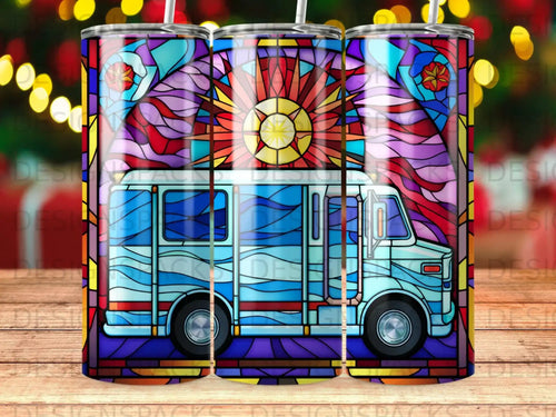 Light blue bus with stained glass pattern, sunburst and colorful windows.