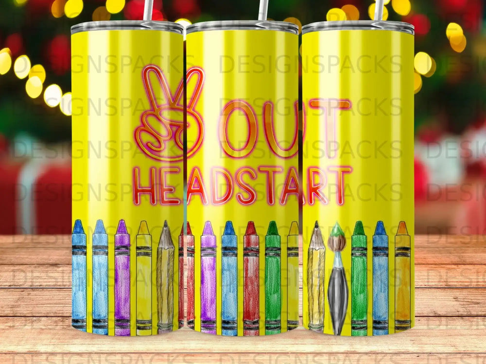 Tumbler with colorful crayons and paintbrushes, "SOUT HEADSTAR" text.