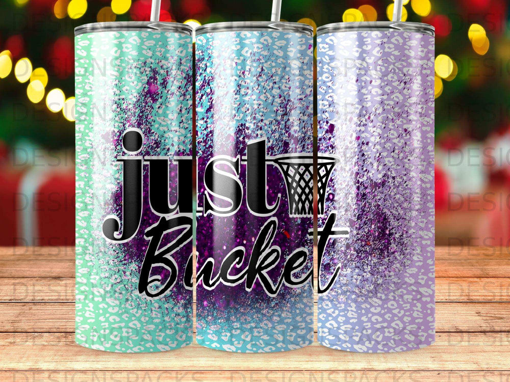 "Just Bucket" text on glittery purple and teal leopard print tumbler.