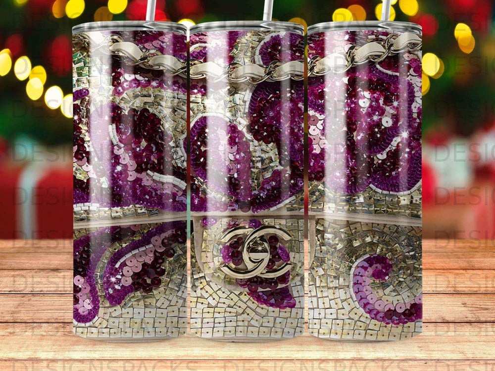 Tumbler with purple sequins and gold chain design, featuring a gold logo.