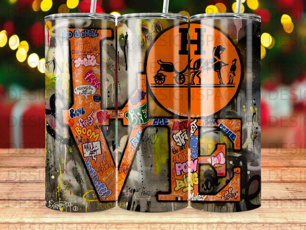 Graffiti-covered tumbler with "LOVE" and Hermes logo.