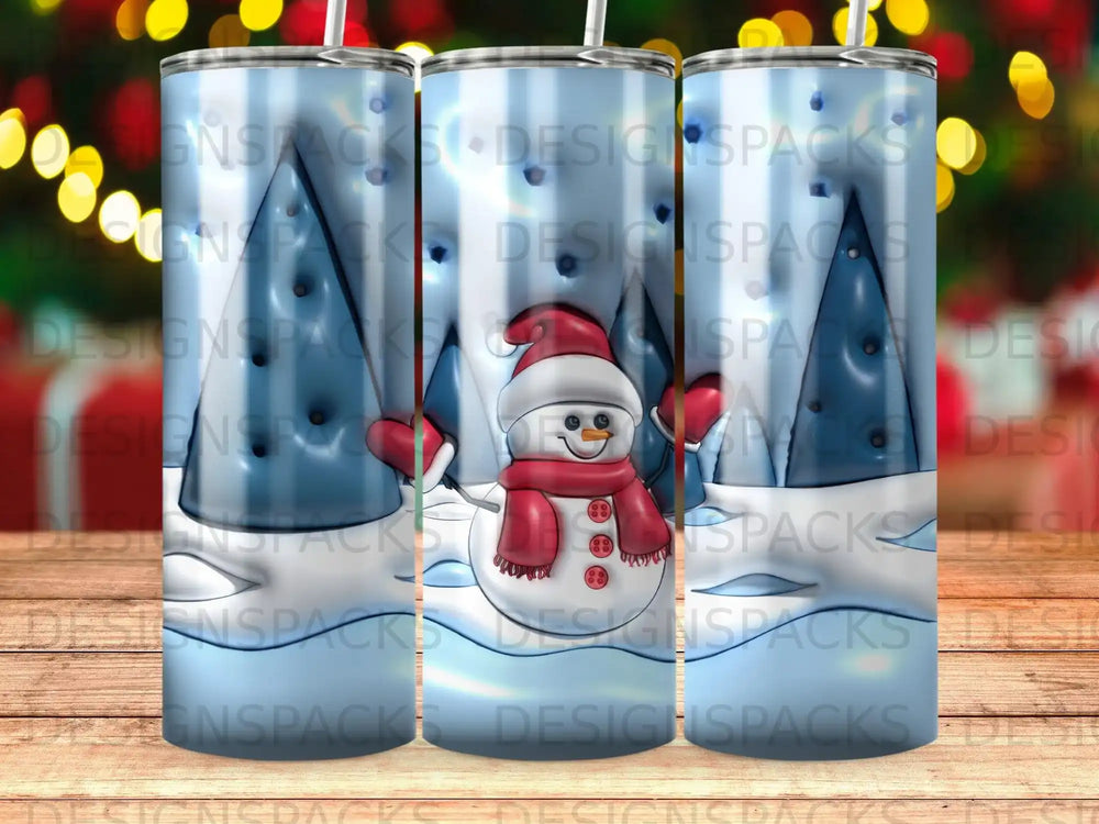 Snowman and snow-covered trees on a blue gradient tumbler.