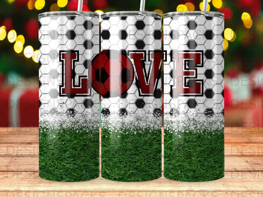 Soccer ball pattern tumbler with "LOVE" text and glitter grass design.