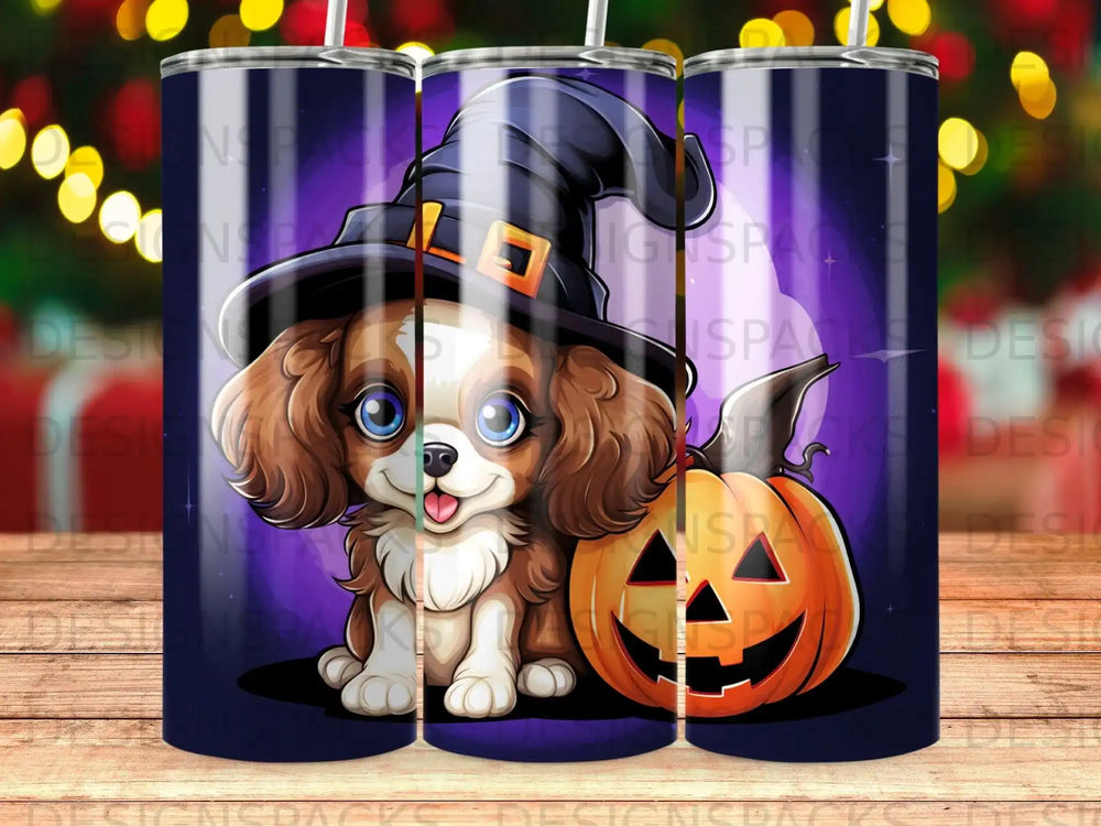 Cavalier King Charles Spaniel puppy in witch hat with pumpkin.