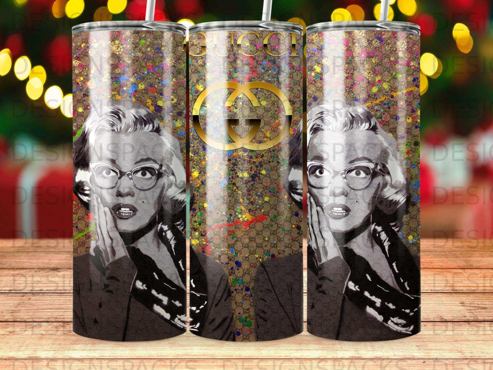 Marilyn Monroe and Gucci logo on a patterned tumbler.