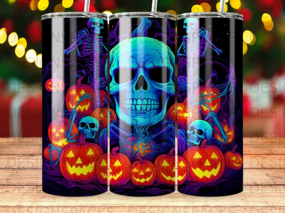 Halloween tumbler featuring a glowing blue skull surrounded by pumpkins and skeletons.