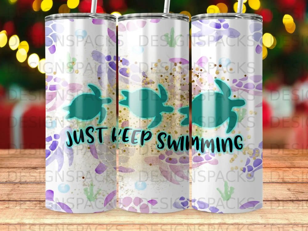 Tumbler with sea turtles and "Just Keep Swimming" text.