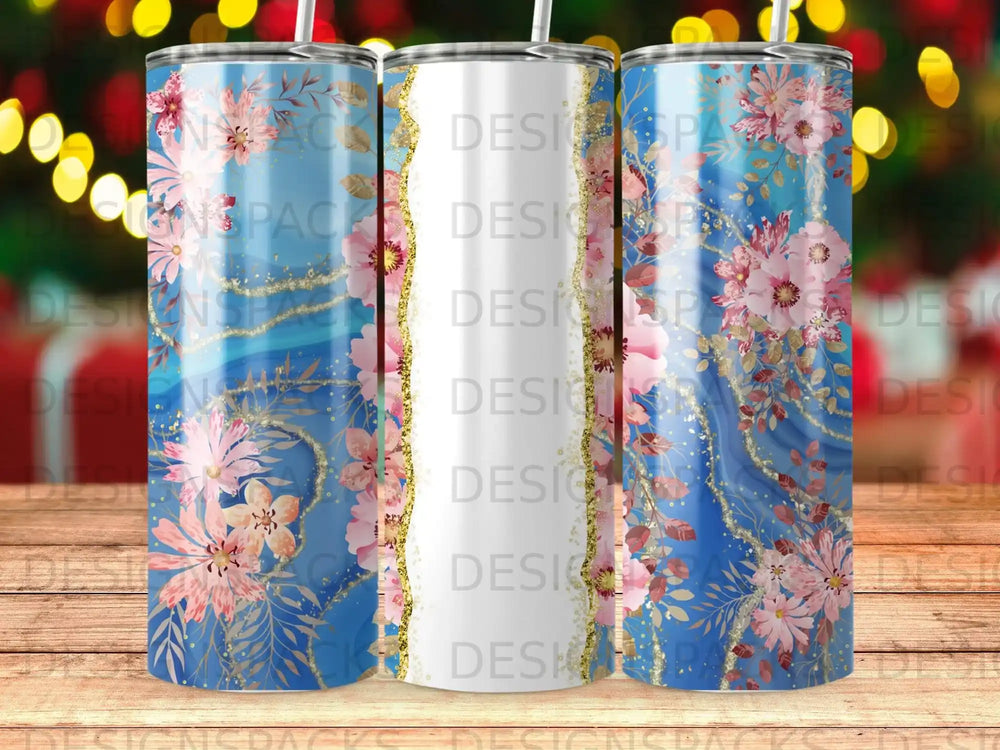 Blue tumbler with pink floral design and gold accents.