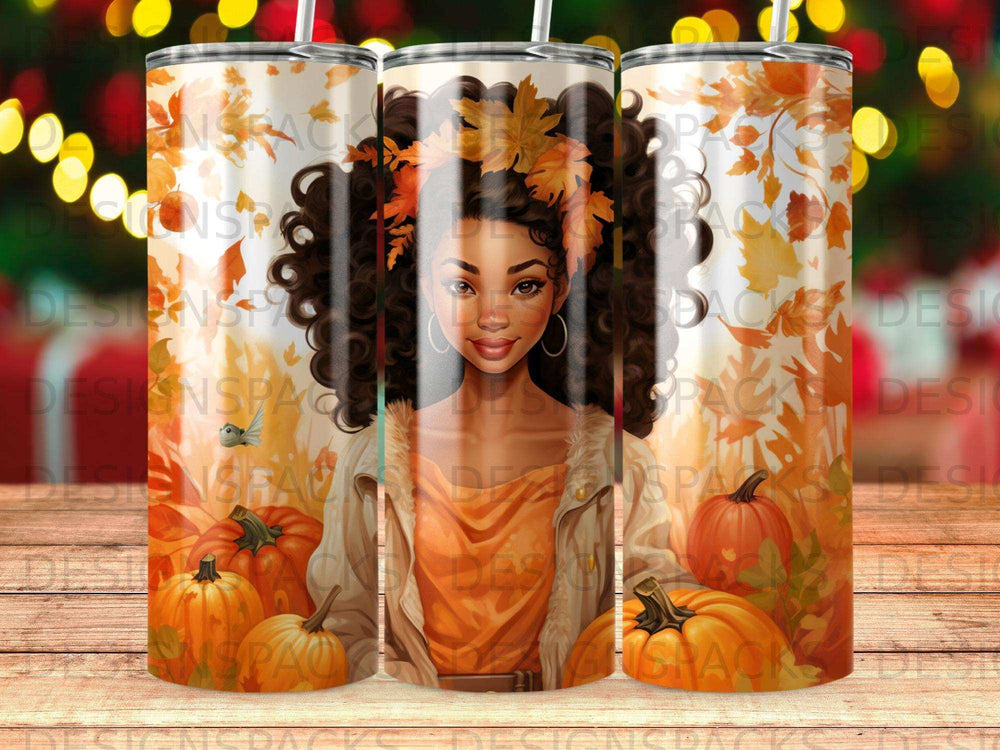 Woman with curly hair and autumn leaves on tumbler with pumpkins.