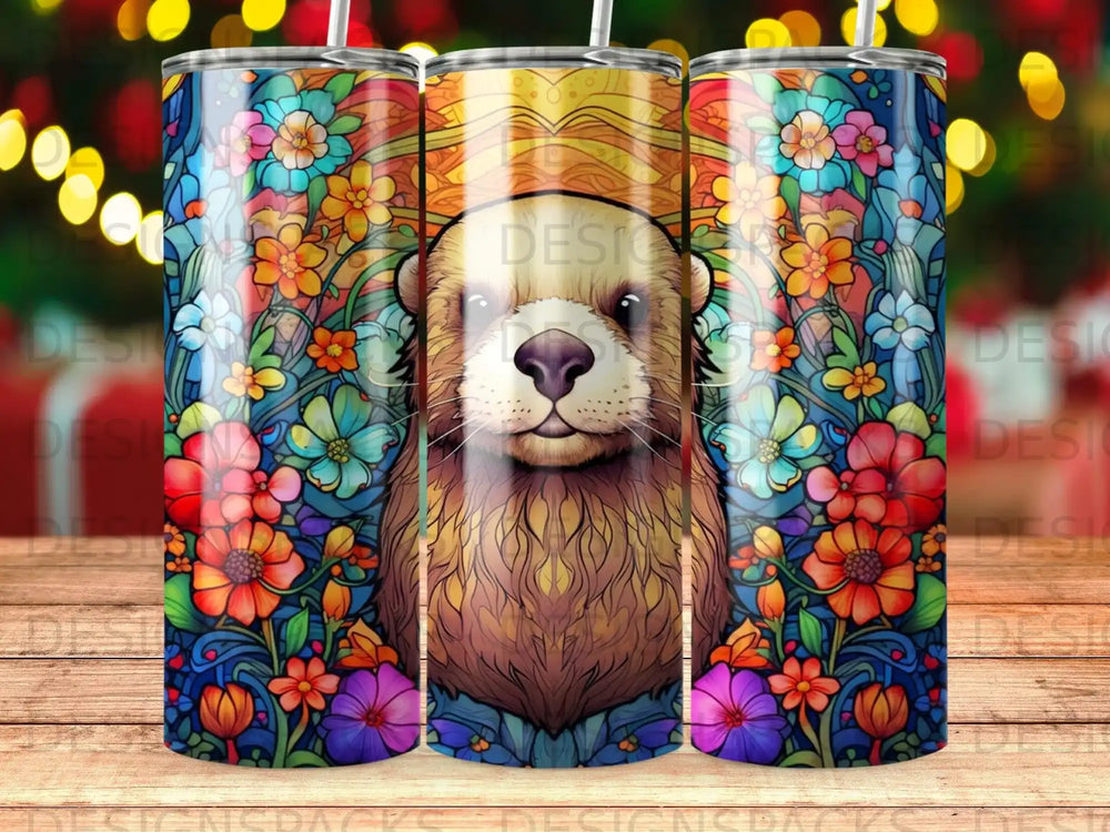 Otter and floral design on a tumbler, with bokeh lights in the background.