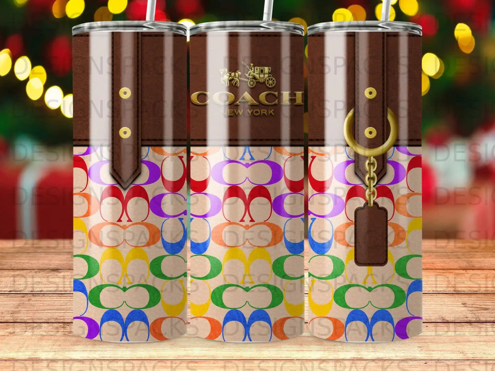Coach logo tumbler with rainbow pattern and gold chain detail.