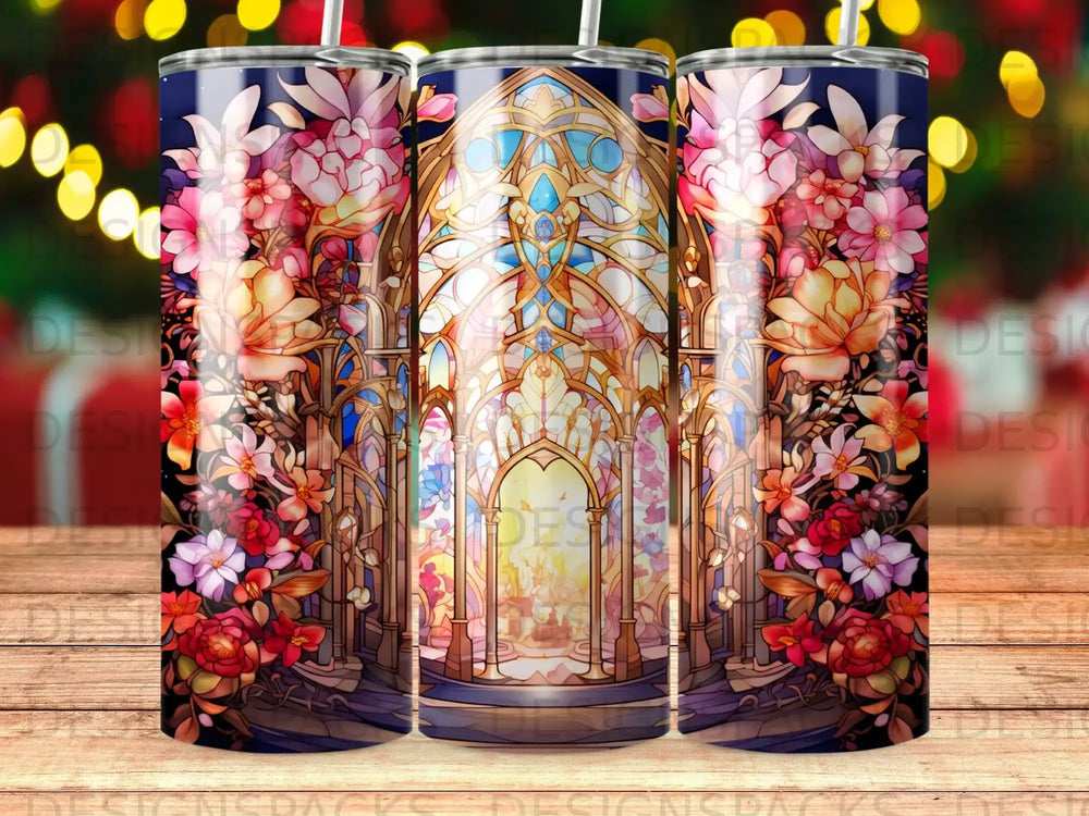 Floral stained glass pattern on three tumblers with bokeh background.