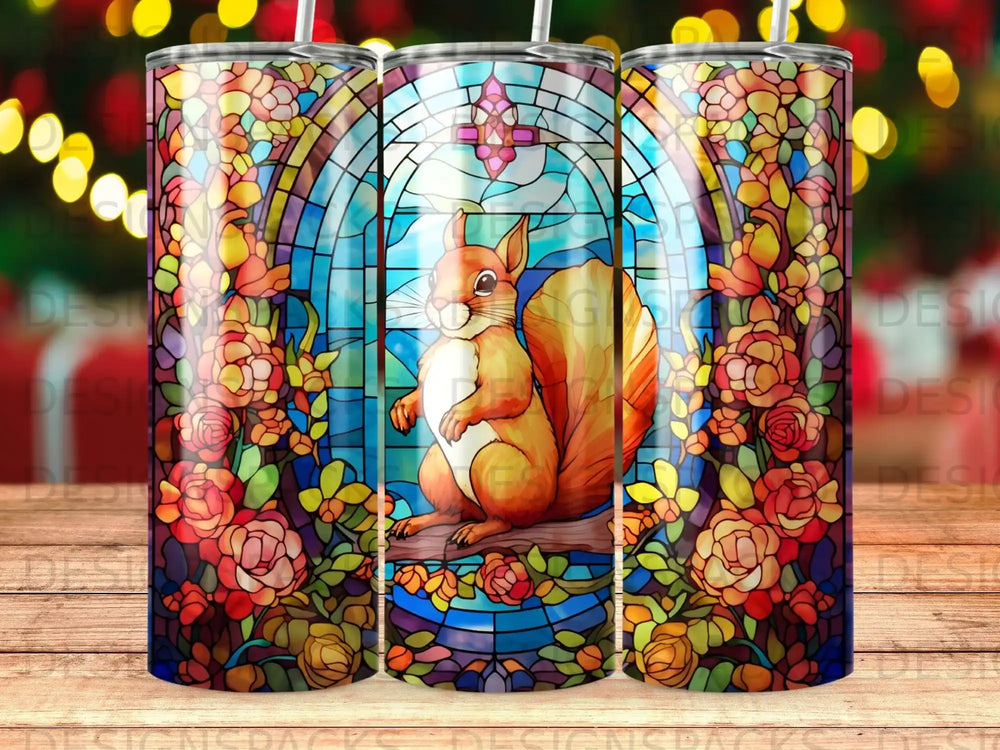 Stained glass tumbler featuring a squirrel in a floral archway.
