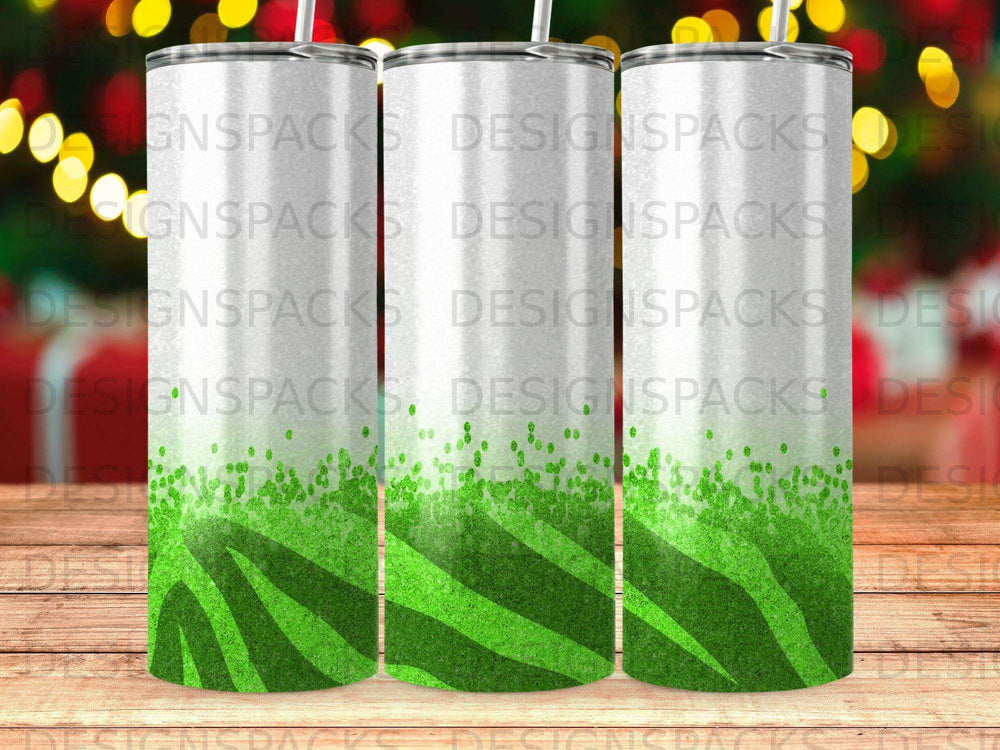 Three white tumblers with green zebra print at the bottom.
