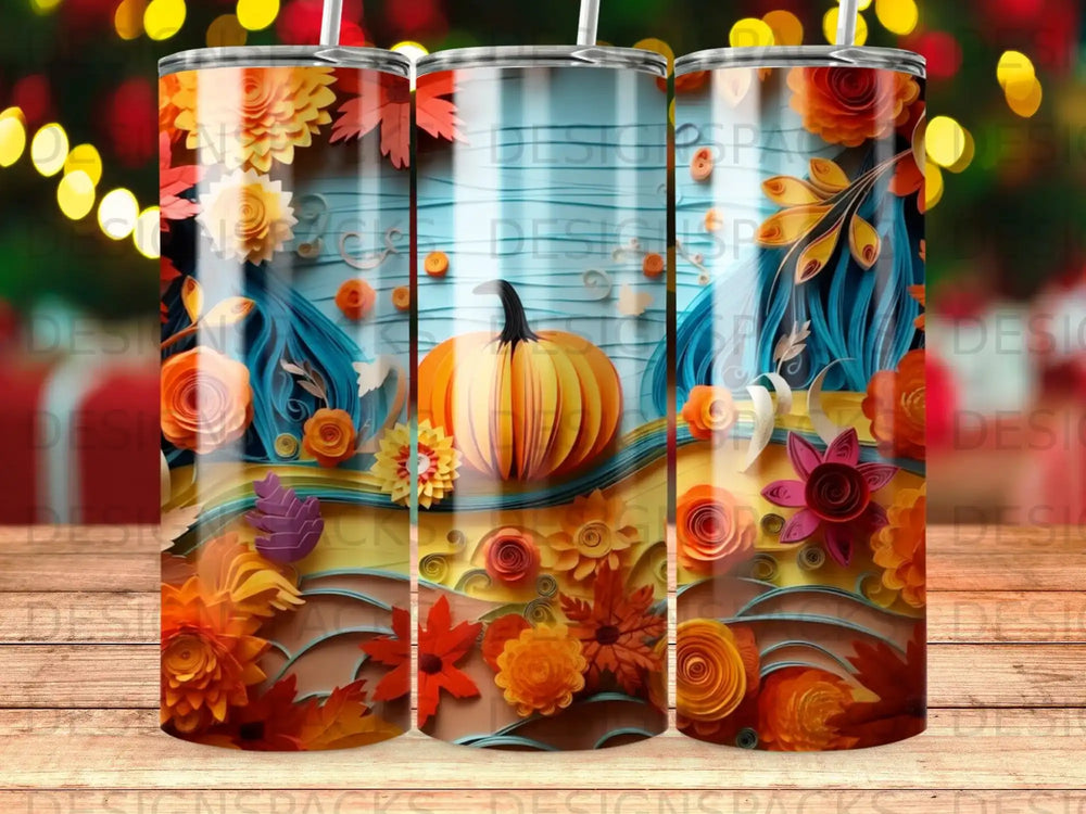 Three tumblers with a fall harvest theme featuring pumpkins and colorful paper flowers.