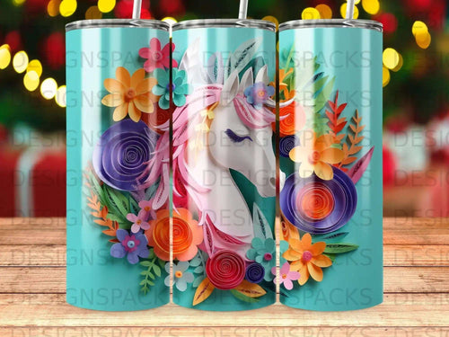 Turquoise tumbler with a pink unicorn and colorful paper flowers.