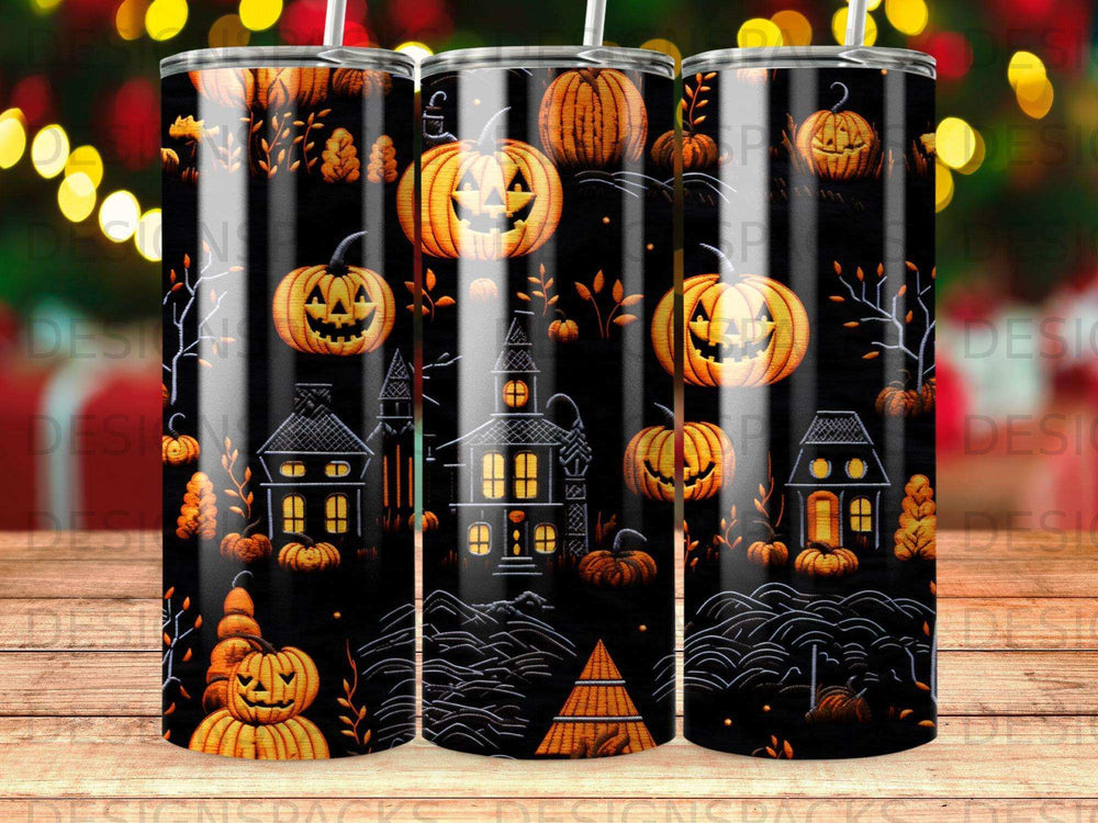 Halloween scene with pumpkins, haunted houses, and trees on a tumbler.