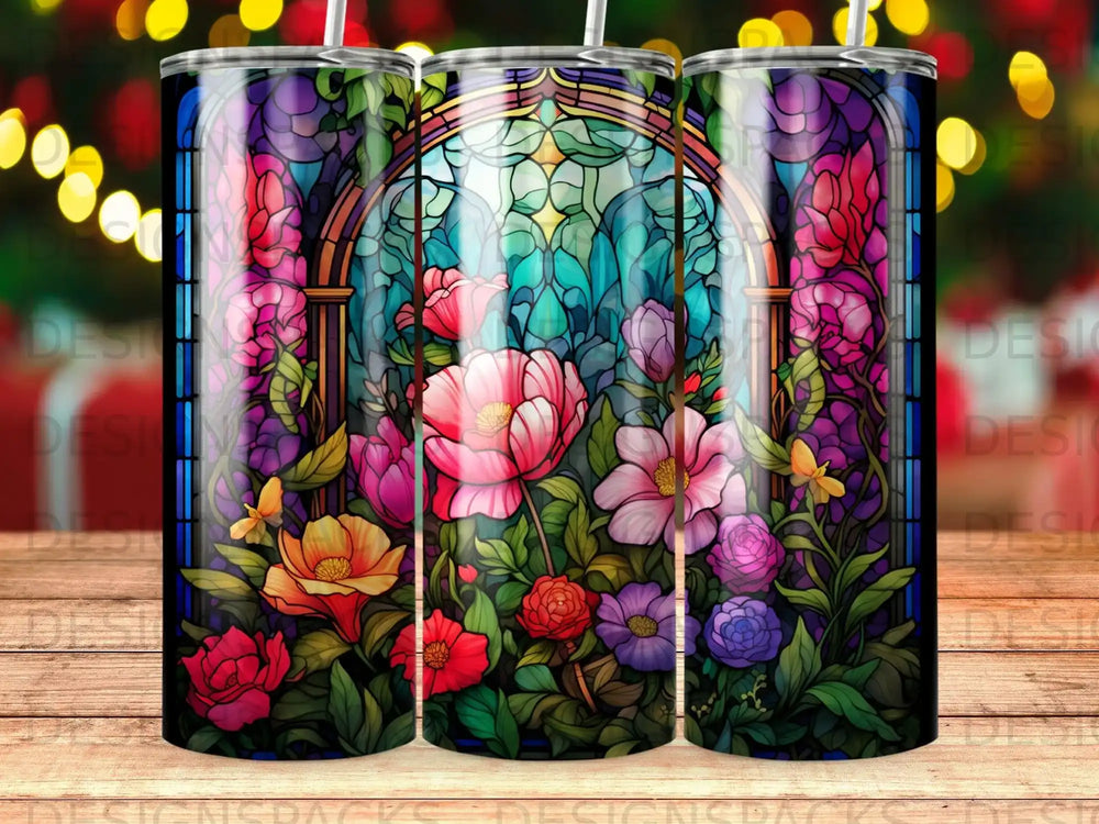 Stained glass design with colorful flowers and architectural details on a tumbler.