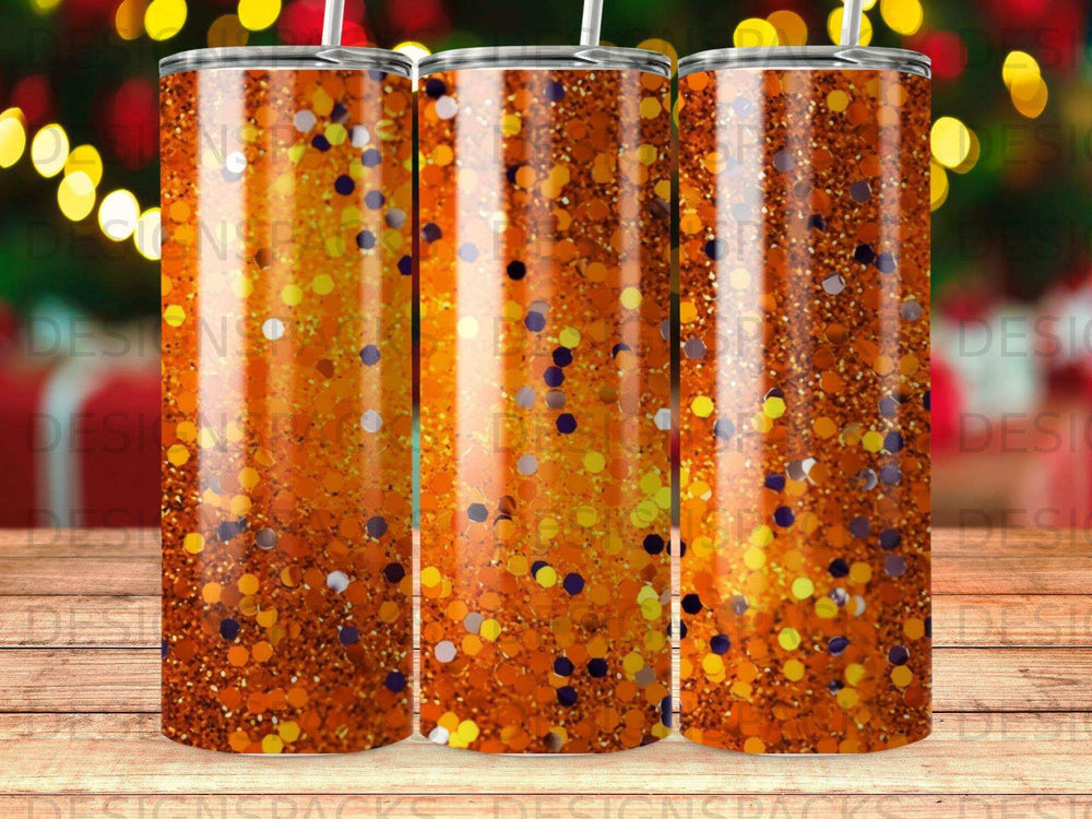 Three glitter tumblers with orange and purple confetti, studio shot.