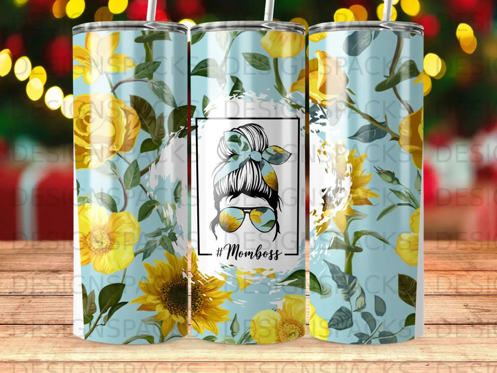 Sunflower and floral pattern tumbler with "Mom boss" text and sunglasses graphic.