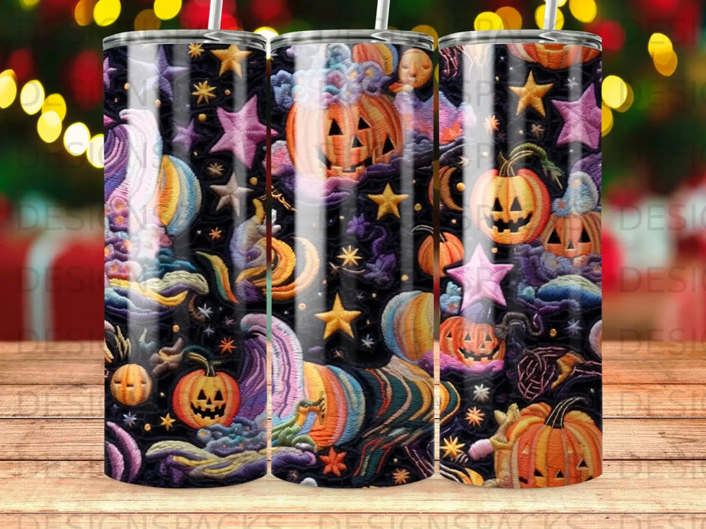 Halloween tumbler with pumpkins, stars, and celestial patterns.