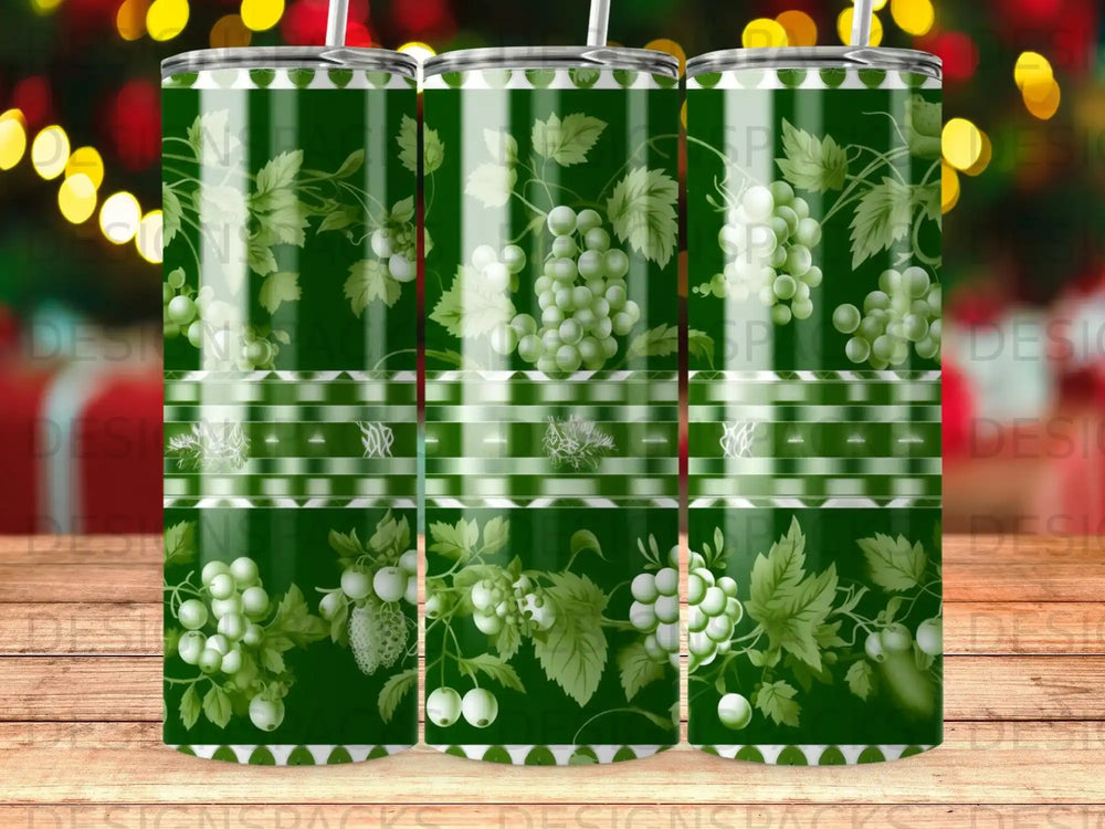 Green tumbler with grape vine pattern and horizontal striped bands.