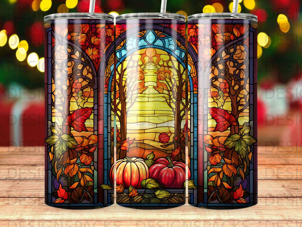 Stained glass design with pumpkins and autumn leaves on a tumbler.