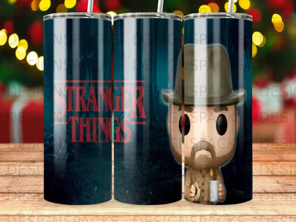 Stranger Things tumbler with character and dark forest background.
