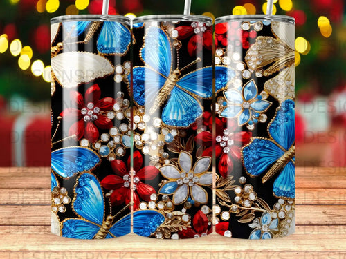 Blue butterflies, red and white flowers, and gold accents on a black tumbler.