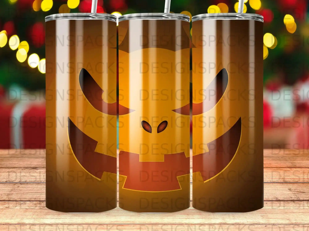 Three Halloween-themed tumblers with jack-o'-lantern faces.