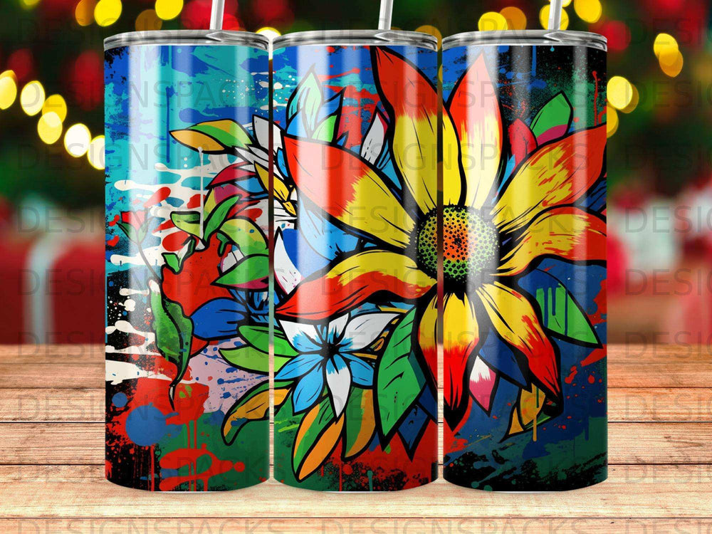 Colorful abstract flower with paint splatters on a tumbler.