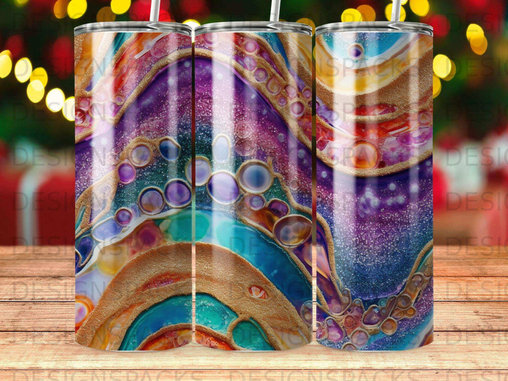 Tumbler with colorful abstract swirling pattern of blues, purples, and gold.