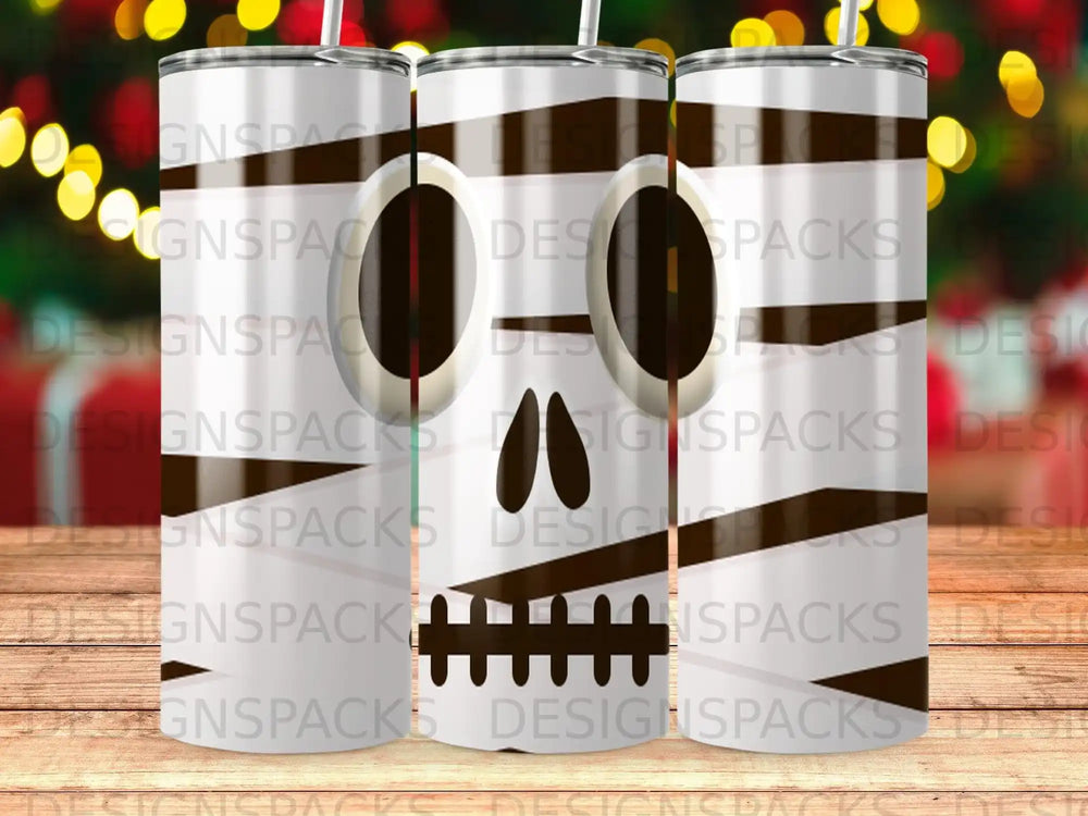 Halloween skull design on a triple tumbler mockup, with bokeh lights background.