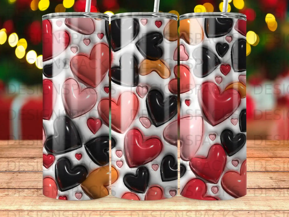 Three tumblers with a repeating pattern of red, pink, and black hearts.