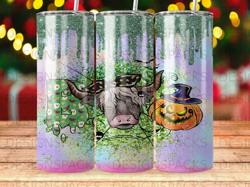 Cow with Halloween decorations, glitter, and pumpkin on a tumbler.