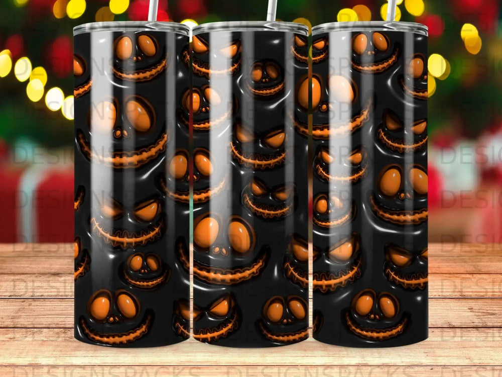 Black tumbler with repeated orange jack-o'-lantern faces design.