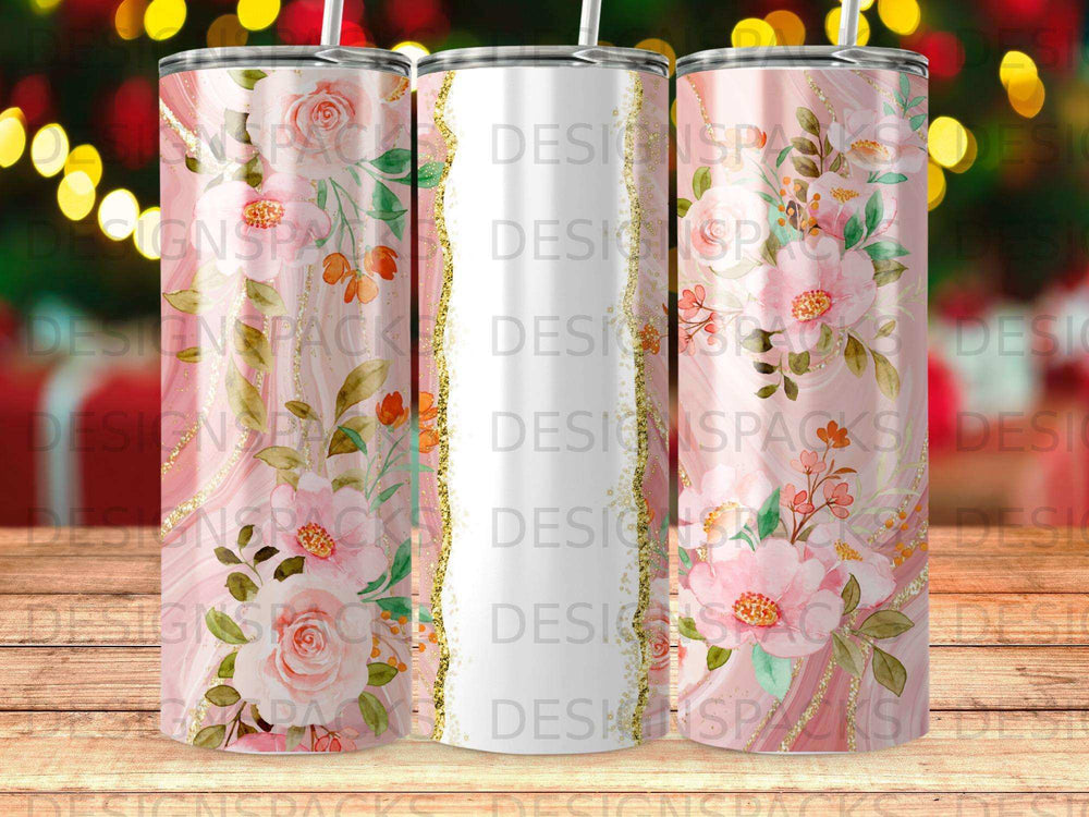 Floral patterned tumblers with decorative gold accents and a blurred festive background.