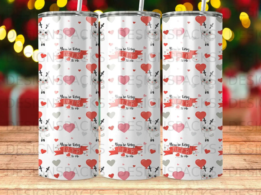 Tumbler with a repeating pattern of cartoon deer and hearts, text reads "You're Very Deer to Me".