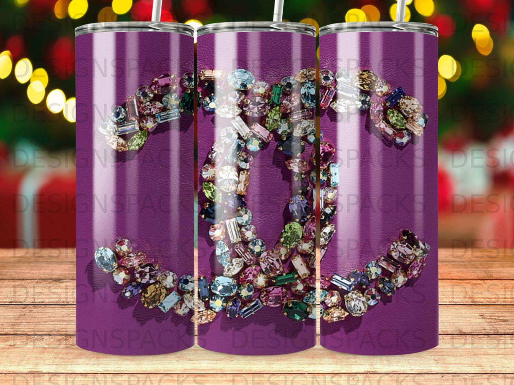 Chanel logo formed by colorful gemstones on a purple background.