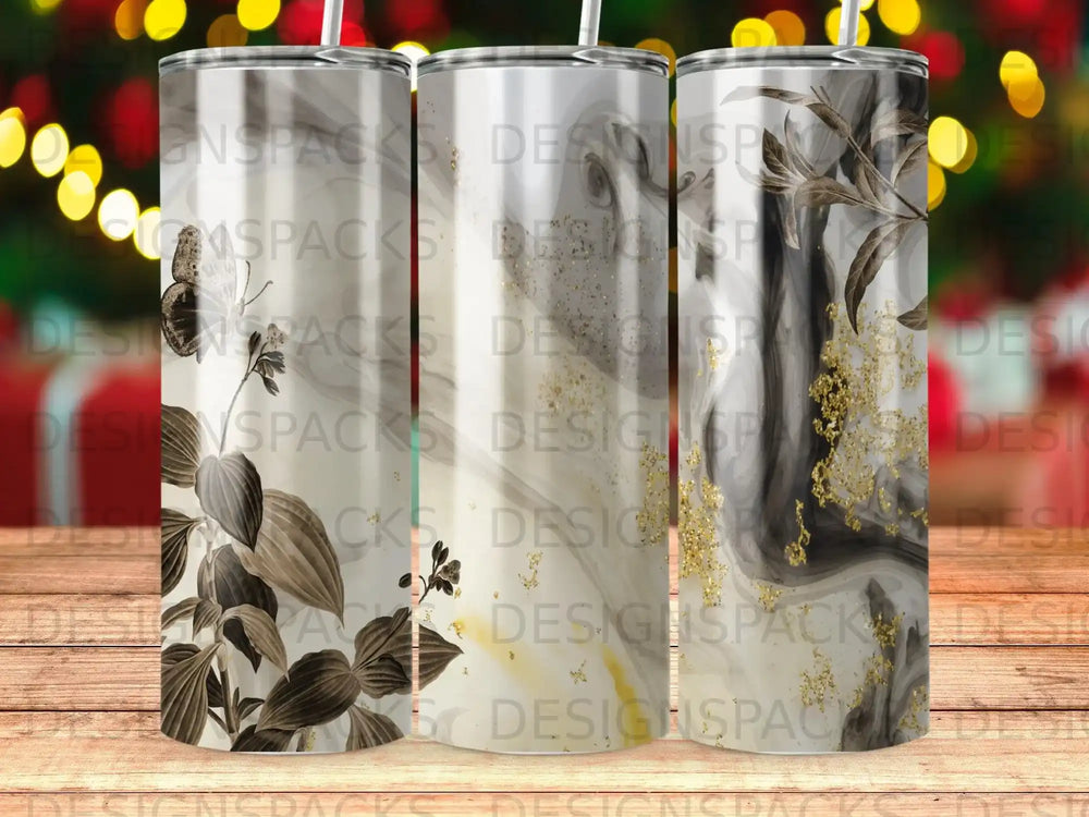 Three tumblers with botanical and marbled designs, featuring a butterfly accent.