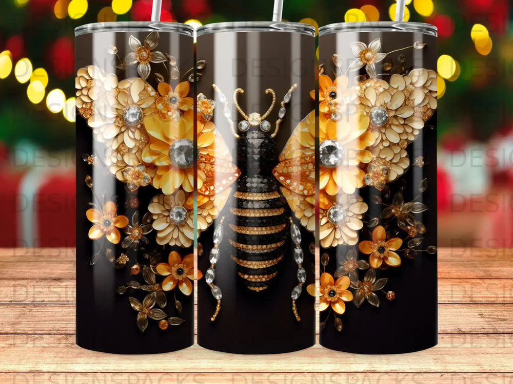 Bejeweled bee and flowers design on a dark tumbler.