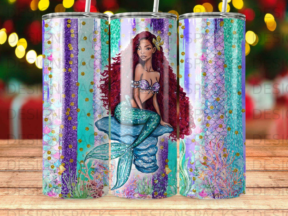 Mermaid with long red hair sitting on a rock, surrounded by colorful glitter and ocean elements.