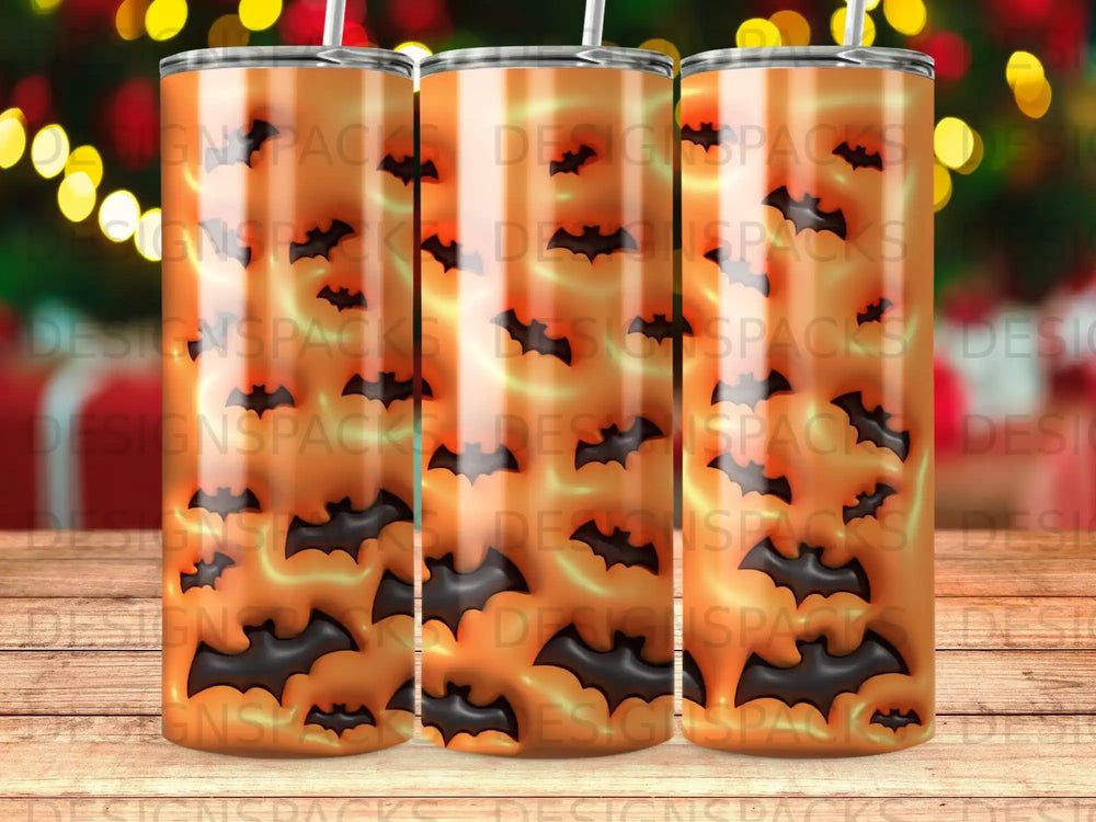 Three tumblers with orange backgrounds and black bat silhouettes.