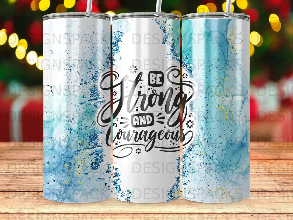Tumbler with "Be Strong and Courageous" text and blue watercolor splatter.